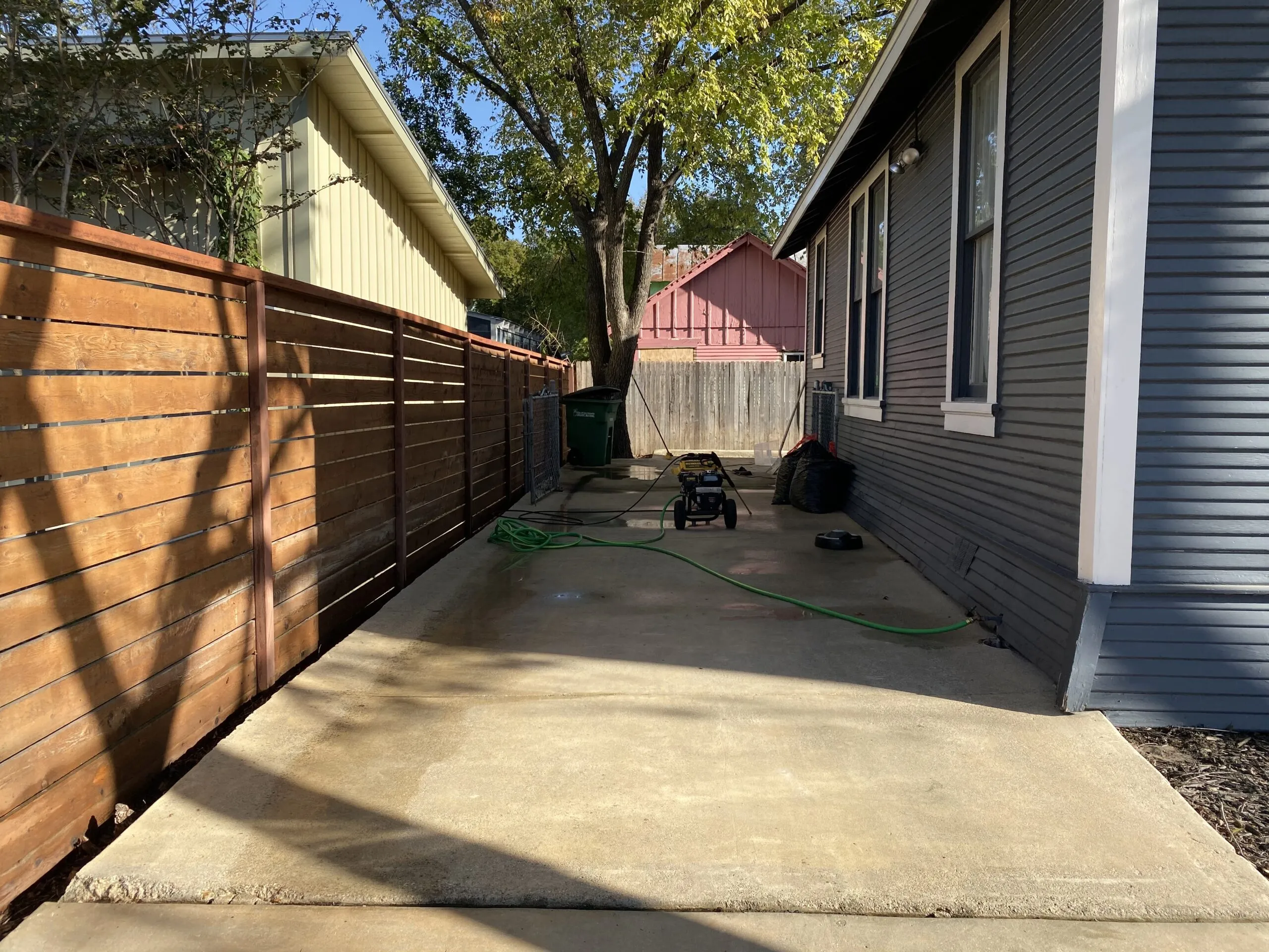 Stained concrete before pressure washing in San Antonio